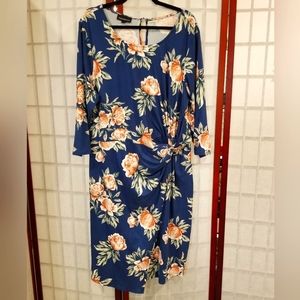Blue floral knot front midi dress. 3/4 sleeve